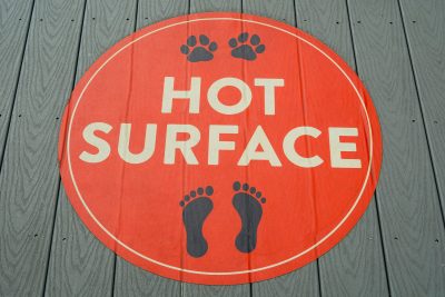 Humorous floor decals in Calgary reading hot surface, designed for clear visibility in public.