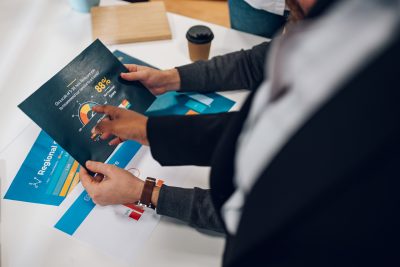 Business professional reviewing marketing materials created through high-quality printing in Calgary.