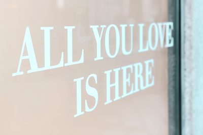 Custom window decals in Calgary used for storefront branding and promotional messaging.