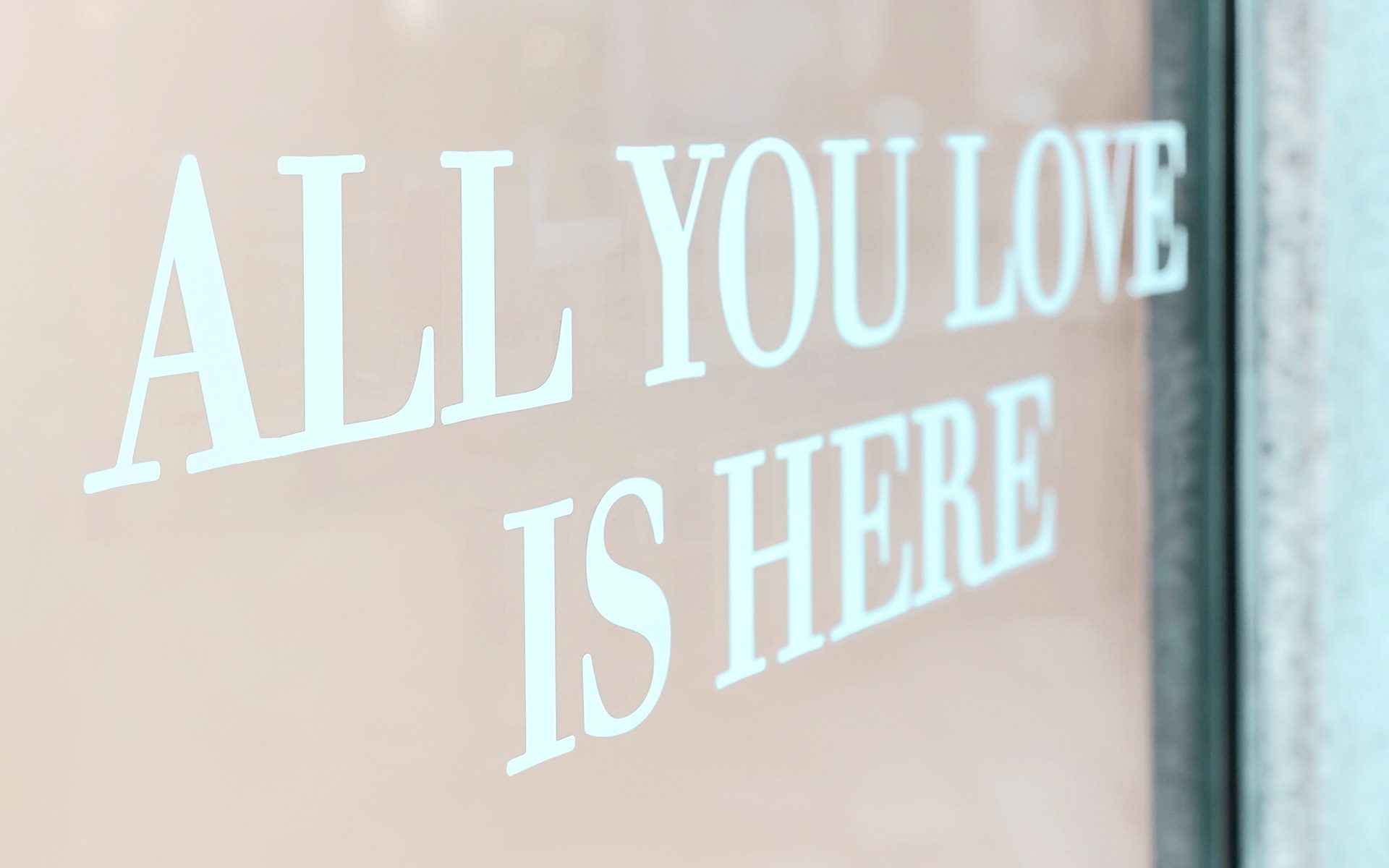 Custom window decals in Calgary used for storefront branding and promotional messaging.